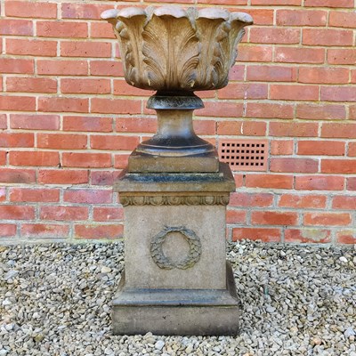 Lot 1484 - An old urn on a plinth base