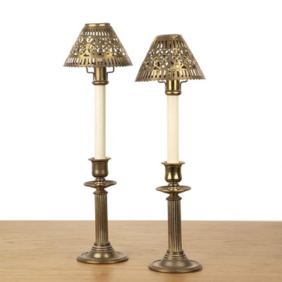 Lot 120 - Pair of oil candle lamps the bases reminiscent...