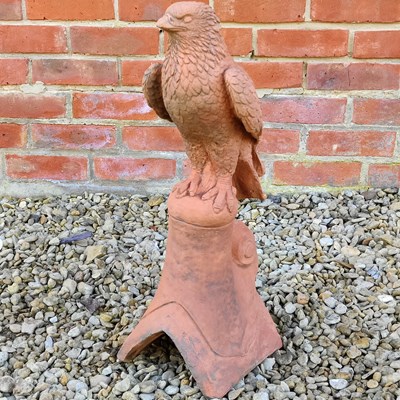 Lot 1441 - A cast reconstituted stone terracotta-coloured roof finial