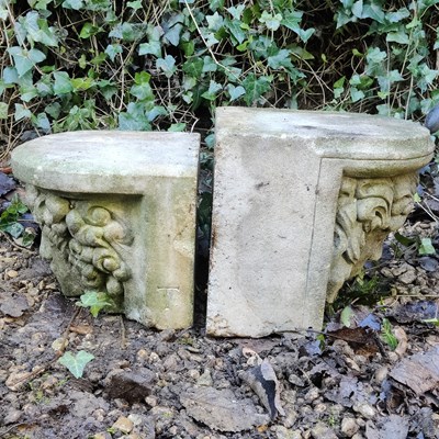 Lot 1482 - Two cast reconstituted stone corbels with female masks