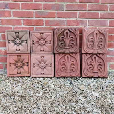 Lot 1548 - A group of eight terracotta wall ornaments or plaques