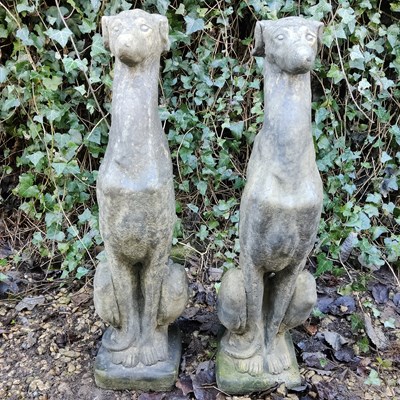 Lot 1511 - A pair of reconstituted stone whippets