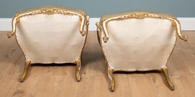 Lot 517 - A pair of 19th century English parcel gilt, cream-painted open armchairs