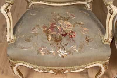 Lot 517 - A pair of 19th century English parcel gilt, cream-painted open armchairs