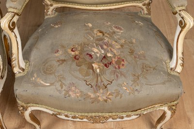 Lot 517 - A pair of 19th century English parcel gilt, cream-painted open armchairs