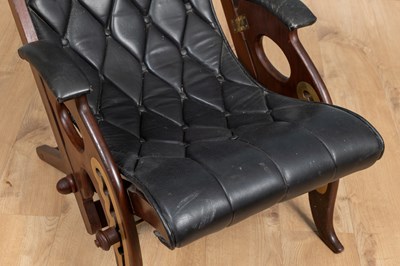 Lot 1031 - A 20th century mahogany-framed leather reclining campaign chair