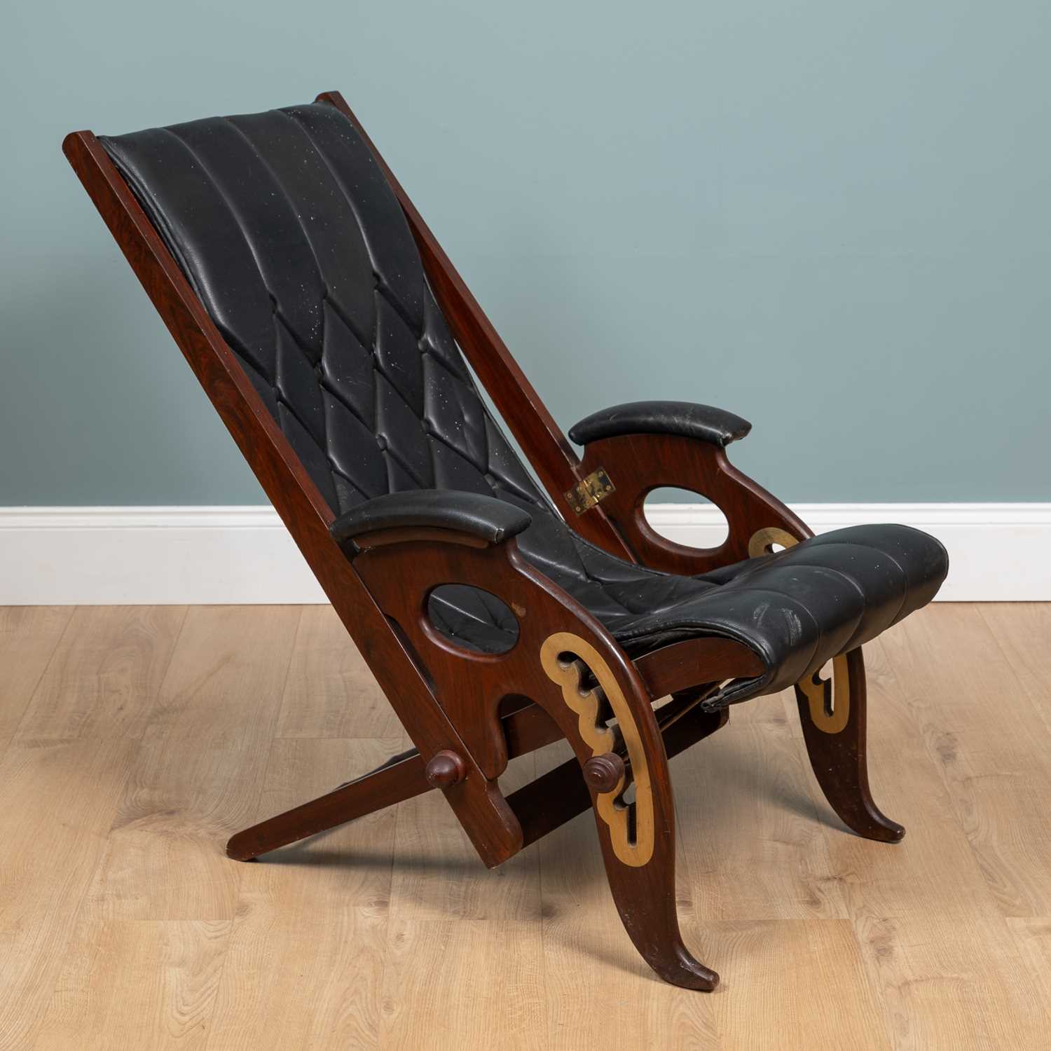 Lot 1031 - A 20th century mahogany-framed leather reclining campaign chair
