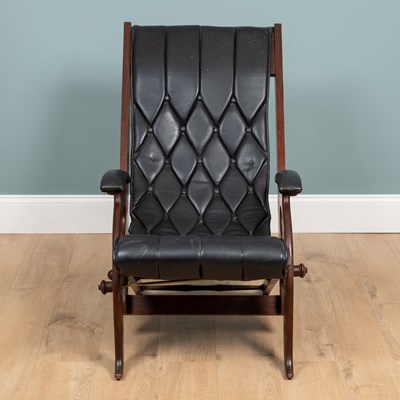 Lot 1031 - A 20th century mahogany-framed leather reclining campaign chair