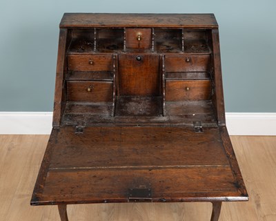 Lot 1066 - A Georgian oak bureau