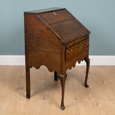 Lot 1066 - A Georgian oak bureau