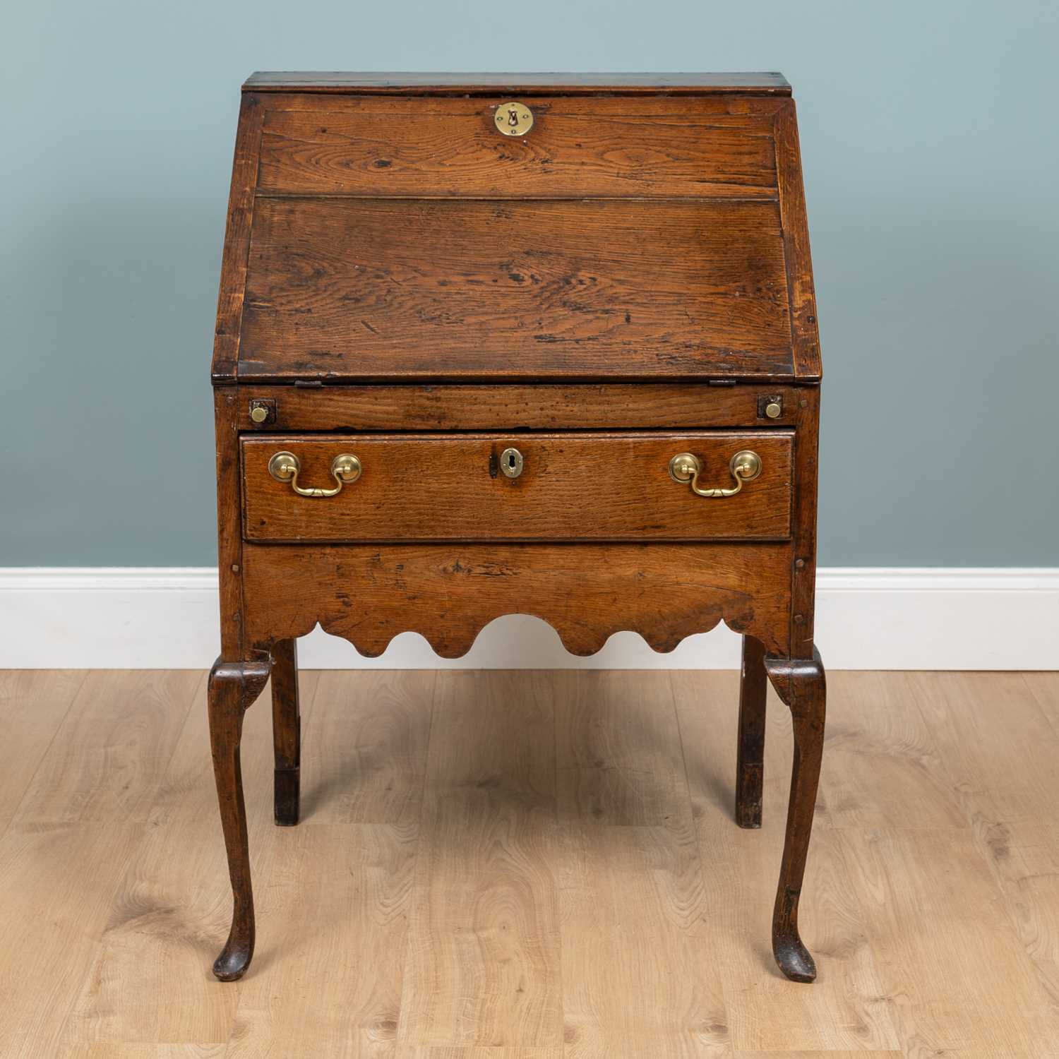 Lot 1066 - A Georgian oak bureau