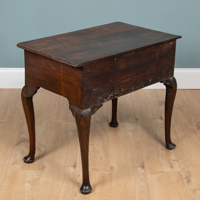 Lot 1072 - A Georgian oak lowboy