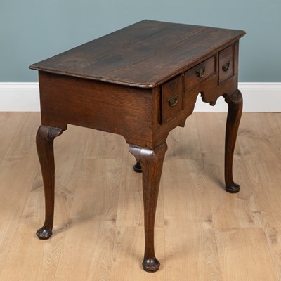 Lot 1072 - A Georgian oak lowboy