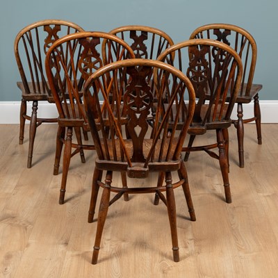 Lot 1057 - A harlequin set of six yew and elm Windsor chairs
