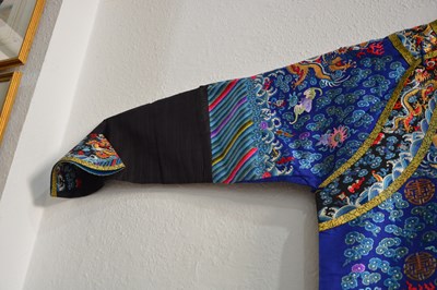Lot 203 - Purple ground silk-embroidered ‘dragon’ robe,...