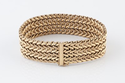 Lot 8 - A 9ct gold fancy-link bracelet, of plaited...