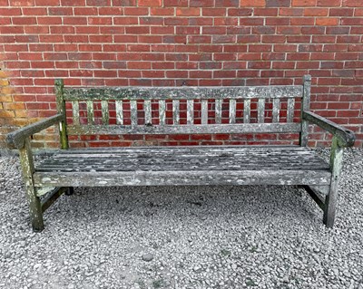 Lot 1473 - A teak garden bench