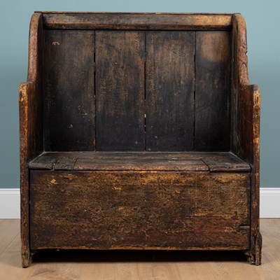 Lot 1228 - A rustic pine box seated small settle