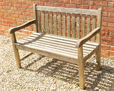 Lot 1485 - A two-seater teak garden bench