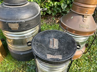 Lot 1446 - A group of four copper and painted iron ship's lanterns