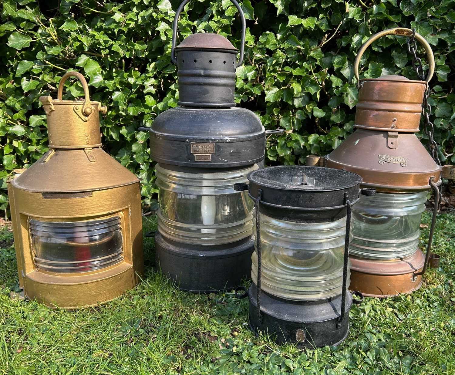 Lot 1446 - A group of four copper and painted iron ship's lanterns