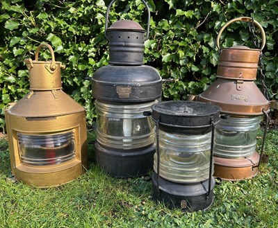 Lot 1446 - A group of four copper and painted iron ship's lanterns