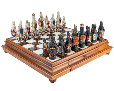 Lot 1155 - A marble chessboard with James Woodford, The Queen's Beast chess pieces