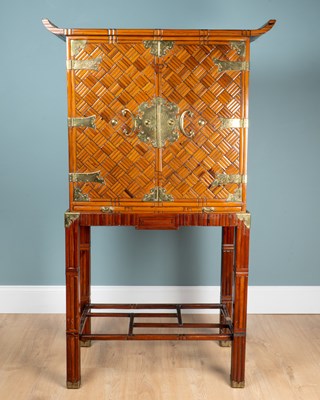 Lot 255 - A bamboo parquetry drinks cabinet on stand