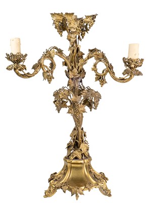Lot 294 - An antique gilt metal three-branch candelabrum