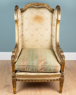 Lot 346 - A Louise XV-style gilt-framed wingback armchair
