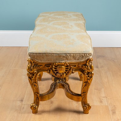 Lot A carved gold-painted wooden stool