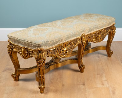 Lot A carved gold-painted wooden stool