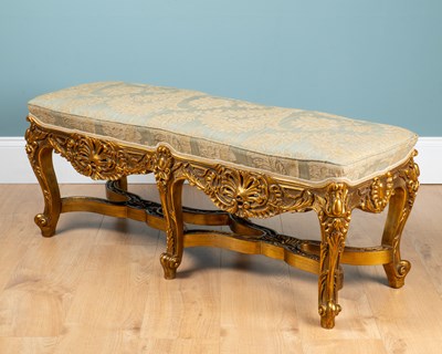 Lot A carved gold-painted wooden stool