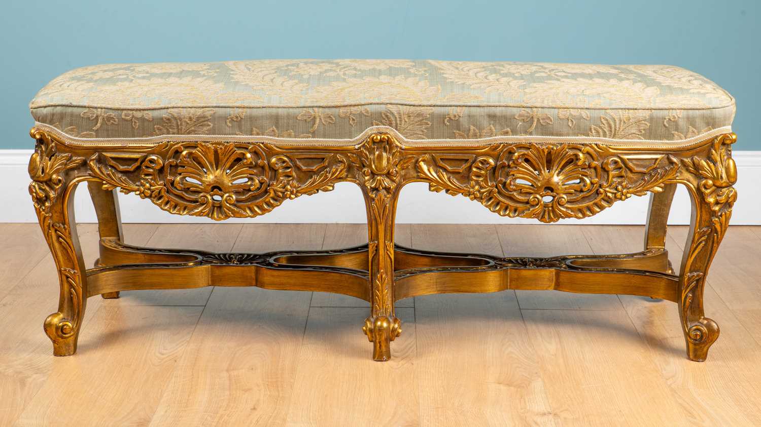 Lot A carved gold-painted wooden stool