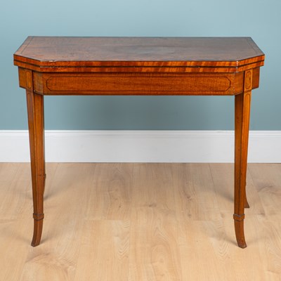 Lot 285 - A George III mahogany fold-over card table