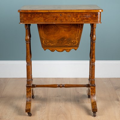 Lot 42 - A Victorian walnut work table