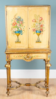 Lot 97 - A 20th century small-sized painted and gilt cabinet on stand