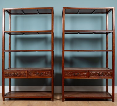 Lot 343 - A pair of Chinese padouk wood display shelves