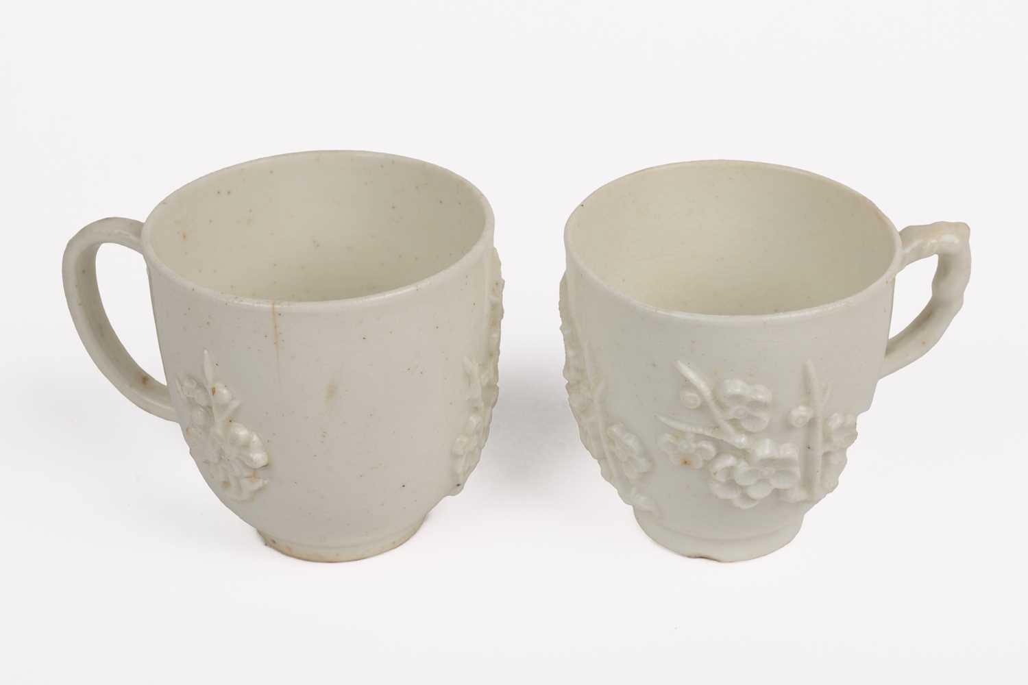 Lot 1362 - Two 18th century Bow porcelain blanc de chine prunus decorated coffee cups