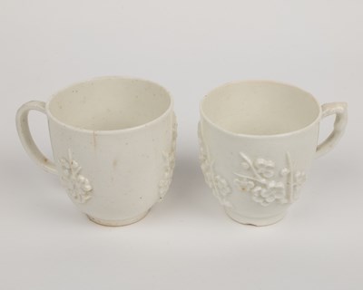 Lot 1362 - Two 18th century Bow porcelain blanc de chine prunus decorated coffee cups