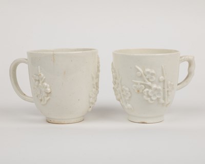 Lot 1362 - Two 18th century Bow porcelain blanc de chine prunus decorated coffee cups