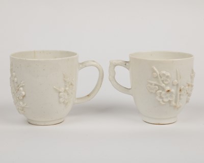 Lot 1362 - Two 18th century Bow porcelain blanc de chine prunus decorated coffee cups