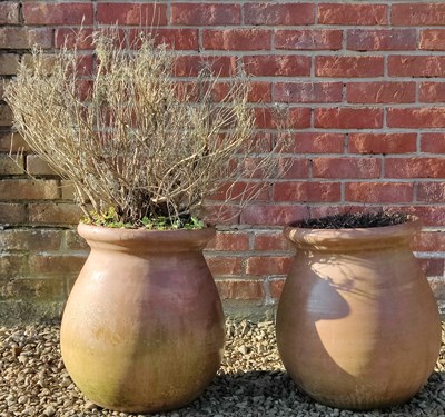 Lot 1433 - A pair of bulbous terracotta plant pots