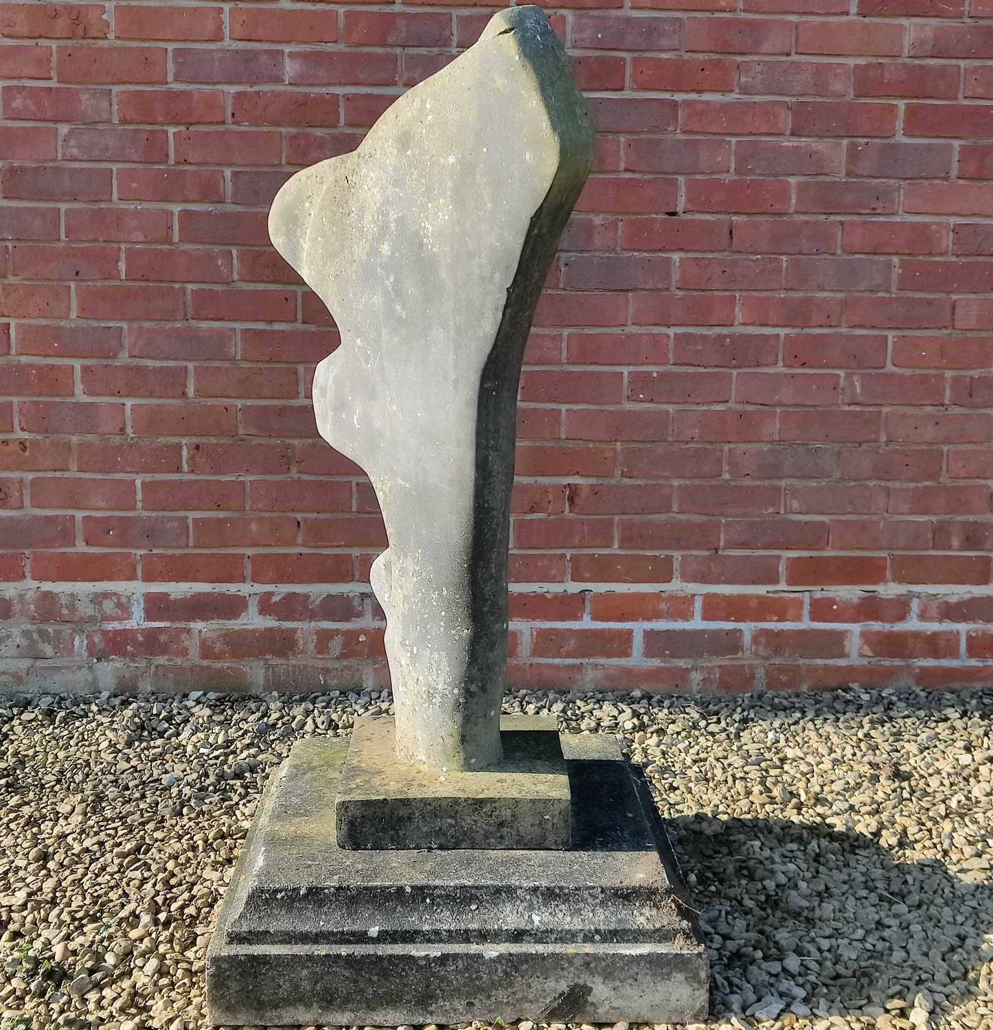 Lot 1560 - A cast composite abstract stone sculpture of a tree