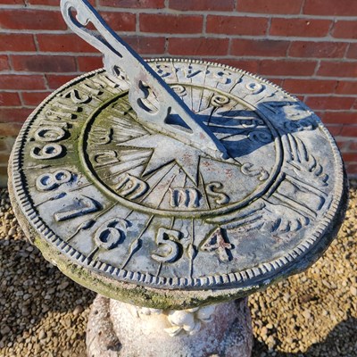 Lot 1457 - A lead sundial on a reconstituted stone base