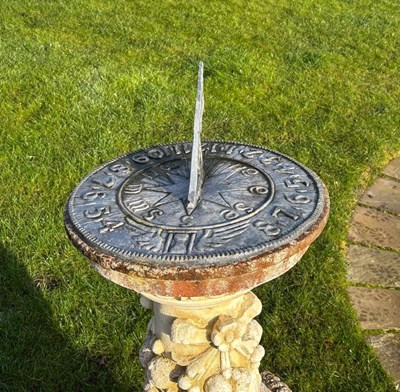 Lot 1457 - A lead sundial on a reconstituted stone base