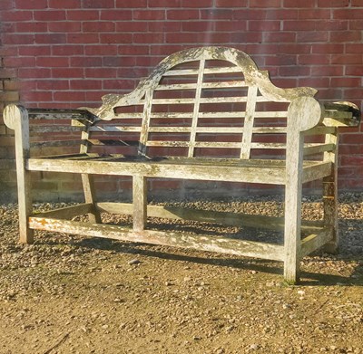 Lot 1532 - A Lutyens-style teak garden bench