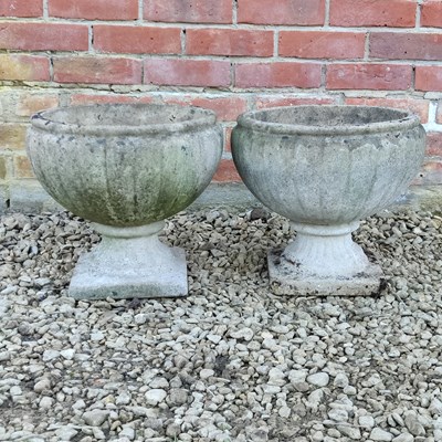 Lot 1479 - A pair of cast reconstituted stone garden planters