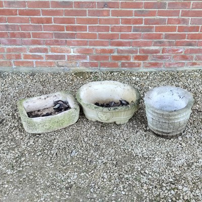 Lot 1524 - A small stone trough and two cast reconstituted stone planters