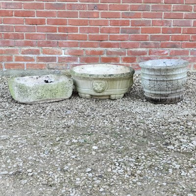 Lot 1524 - A small stone trough and two cast reconstituted stone planters